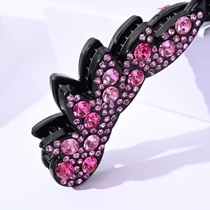 Elegant black banana hair clip with pink rhinestones and scalloped edges for women