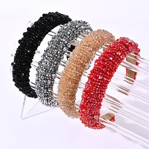 Detailed macro view of handmade baroque crystal beaded headbands in various colors