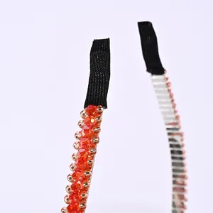 Close-up of crystal beaded headband with orange faceted beads and protective ends
