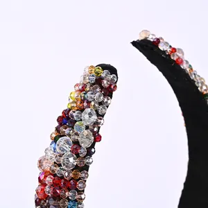 Macro detail of colorful crystal beaded wide headband with elegant vintage baroque style