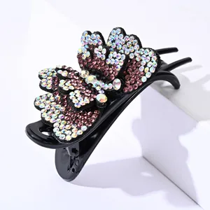 Sparkling double-layered butterfly hair claw clip with colorful rhinestones on white base
