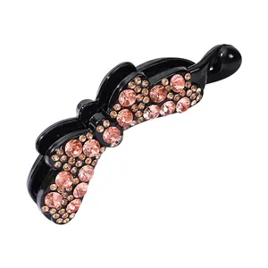 Fermaglio a banana nero con strass rosa brillanti e motivo floreale per capelli