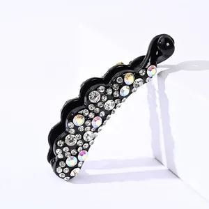 Pince à cheveux banane scintillante avec strass colorés sur monture noire courbée