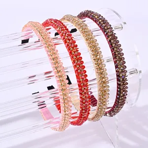 Set van vier vintage haarbanden met kristallen kralen in roze, rood en champagne