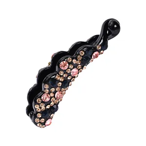Pince à cheveux banane ondulée sertie de strass colorés sur une base en résine noire