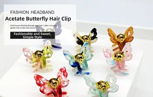 Lot de huit pinces à cheveux papillon en acétate avec textures marbrées de diverses couleurs
