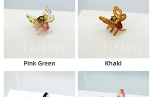 Vues détaillées de pinces à cheveux papillon en acétate en rose, vert et kaki