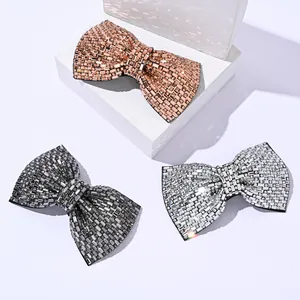 Sparkling crystal bow hair clip set in rose gold, gun black, and silver finishes