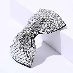 Detailed view of handmade crystal bow hairclip with rectangular and round rhinestones