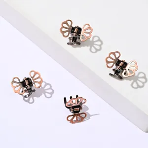 Set of four vintage copper butterfly hair claws with hollow design and spring mechanism