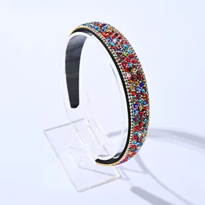 Fashion wide headband with colorful rhinestones and gold chain trim in black color