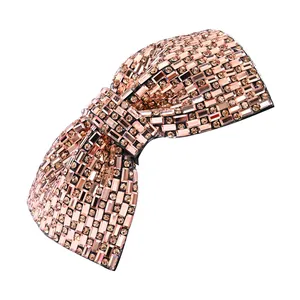 Champagne gold crystal bow hair clip with sparkling rhinestones and baroque design