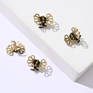 Set of four vintage butterfly mini metal hair clips with an antique bronze finish