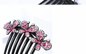 Detailed macro view of pink rhinestones on a black seven-tooth elegant hair comb accessory