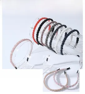 Detail of beaded braided headbands on acrylic stands in multiple colors for hair styling
