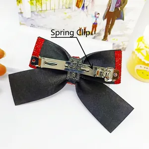 Barrette à nœud en strass rouges avec tissu noir et pince à ressort en métal argenté