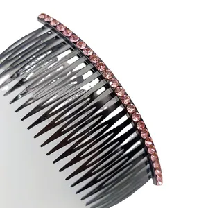 Elegant black hair comb with rows of sparkling pink rhinestones for hairstyling