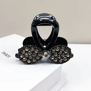Pince à cheveux noeud noir élégante avec strass gris foncé et cristal brillant