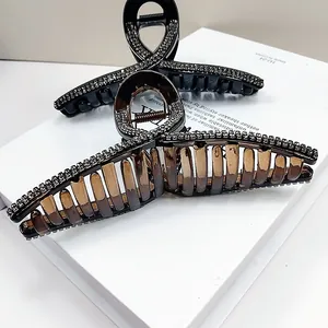 Elegant large black hair claw set with sparkling rhinestones for sophisticated styling