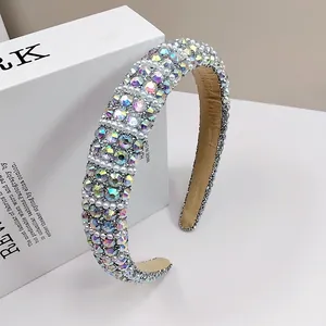 Detail of sponge headband featuring iridescent AB rhinestones and white pearls with velvet lining