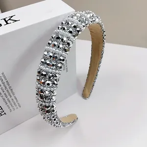 Macro detail of luxury sponge headband with sparkling rhinestones and white pearls