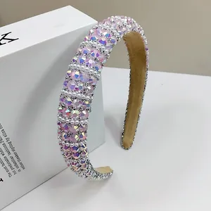 Detailed view of luxury padded headband with shimmering rhinestones and faux pearls
