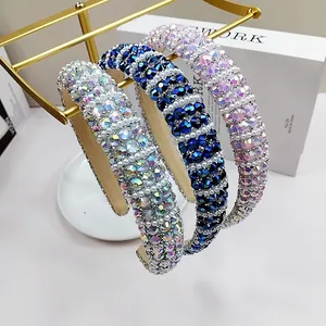 Baroque padded headband set with colorful rhinestones and white pearls on golden stand