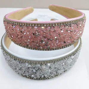 Detail of wide sparkling crystal headbands featuring pink and silver rhinestones
