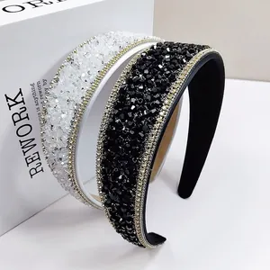 Detail of luxury crystal headbands with hand-stitched beads and golden chain trim