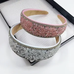 Detail of pink and silver crystal headbands with thick edges and metallic chain trim