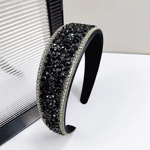 Detail of wide headband with black faceted beads and crystal rhinestones on velvet
