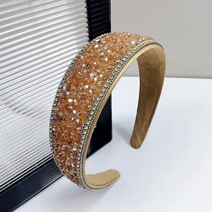 Sparkling crystal padded headband with amber rhinestones and elegant gold bead trim