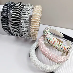 Detailed close-up of colorful baroque padded headbands with pearls and crystal beads