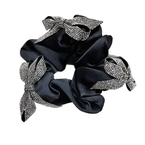 Elegant black satin scrunchie with three sparkling rhinestone butterfly charms for women