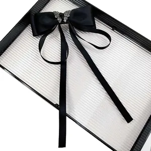 Elegant black satin bow hair clip with crystal butterfly and long silk ribbons