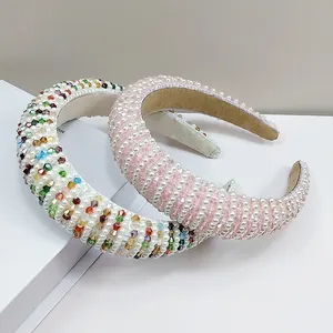 Detailed macro view of handmade crystal pearl padded headbands in pink and multicolor