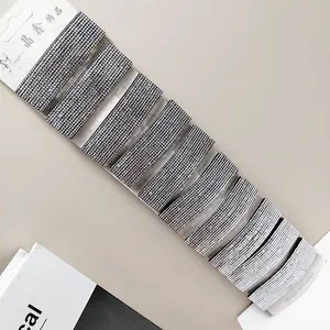 Macro shot of 10-piece rectangle hair clip set with sparkling rhinestones on display card