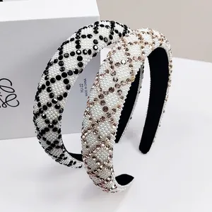 Detail showing two padded headbands with geometric pearl and rhinestone embellishments