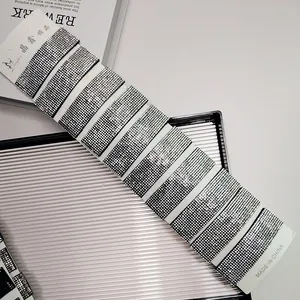 Detail showing ten sparkling silver rhinestone hair clips on a white presentation card