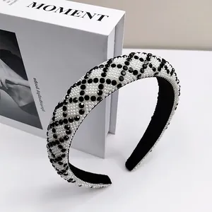 Detail showing the checkered pattern of pearls and black crystals on the thick headband