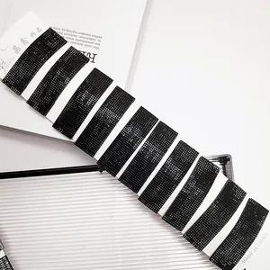Set of 10 black glitter rectangle hair clips on a white display card for women