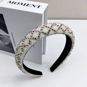Detail of crystal headband with white pearls and champagne rhinestones in lattice pattern