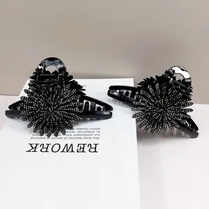 Elegant black sunflower hair claw clip with sparkling rhinestones for women