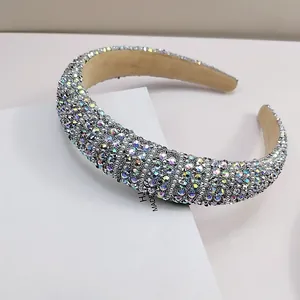 Macro detail of headband with sparkling AB rhinestones and white pearls on thick velvet band