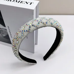 Detail of wide headband featuring encrusted faux pearls and iridescent AB crystals