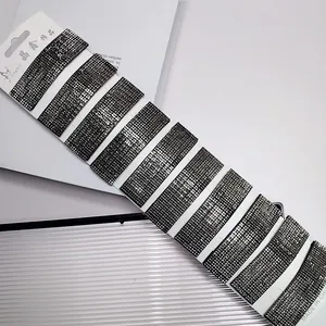 Set of ten rectangular duckbill hair clips featuring dark grey rhinestones on a white card