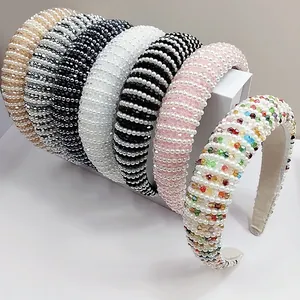 Detailed view of handmade crystal and pearl headbands in various colors and styles