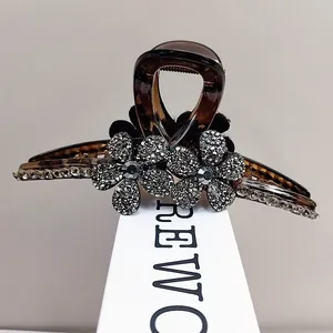 Pince à cheveux écaillée élégante avec fleurs en cristal et strass brillants sur les bords