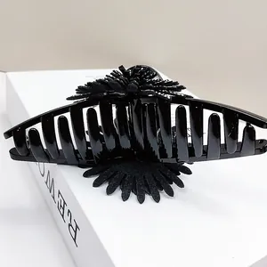 Large black sunflower hair claw clip with rhinestones for women on white display box