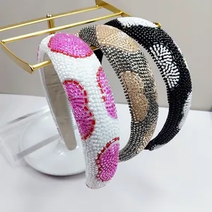 Three-piece set of handmade beaded headbands with various patterns on a gold display stand